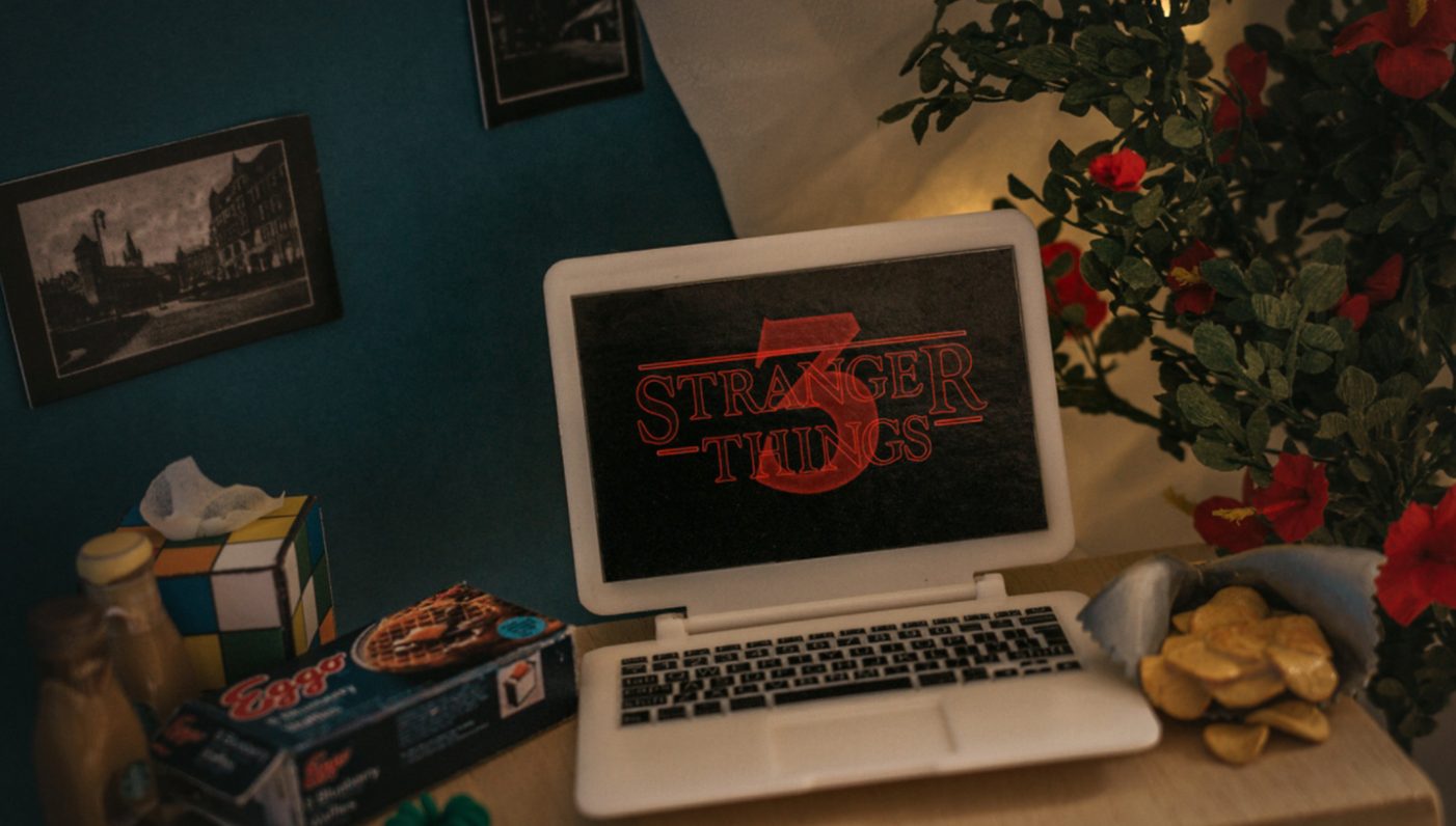 stranger things movie playing on a laptop