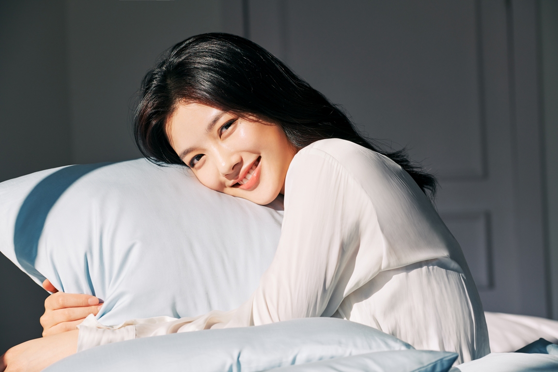 woman waking up with healthy skin after using LANEIGE Water Sleeping Mask