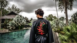 man in front of a pool in Slate Phuket
